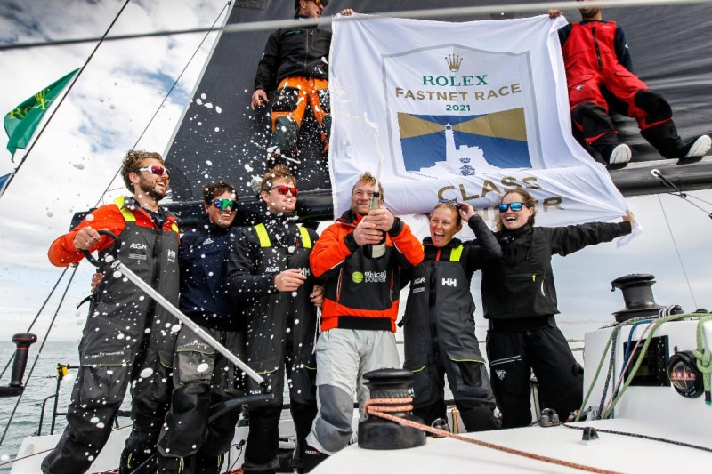 Tor Tomlinson (2nd right) on board Sunrise after finishing the 2021 Rolex Fastnet Race © Paul Wyeth