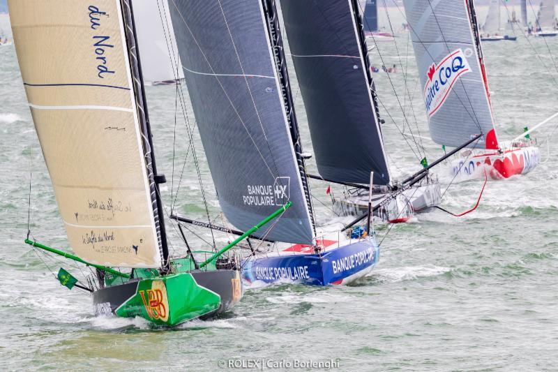 Heading off for their first night at sea, the largest fleet of IMOCA 60s to ever compete in the Rolex Fastnet Race made a spectacle at the start in th