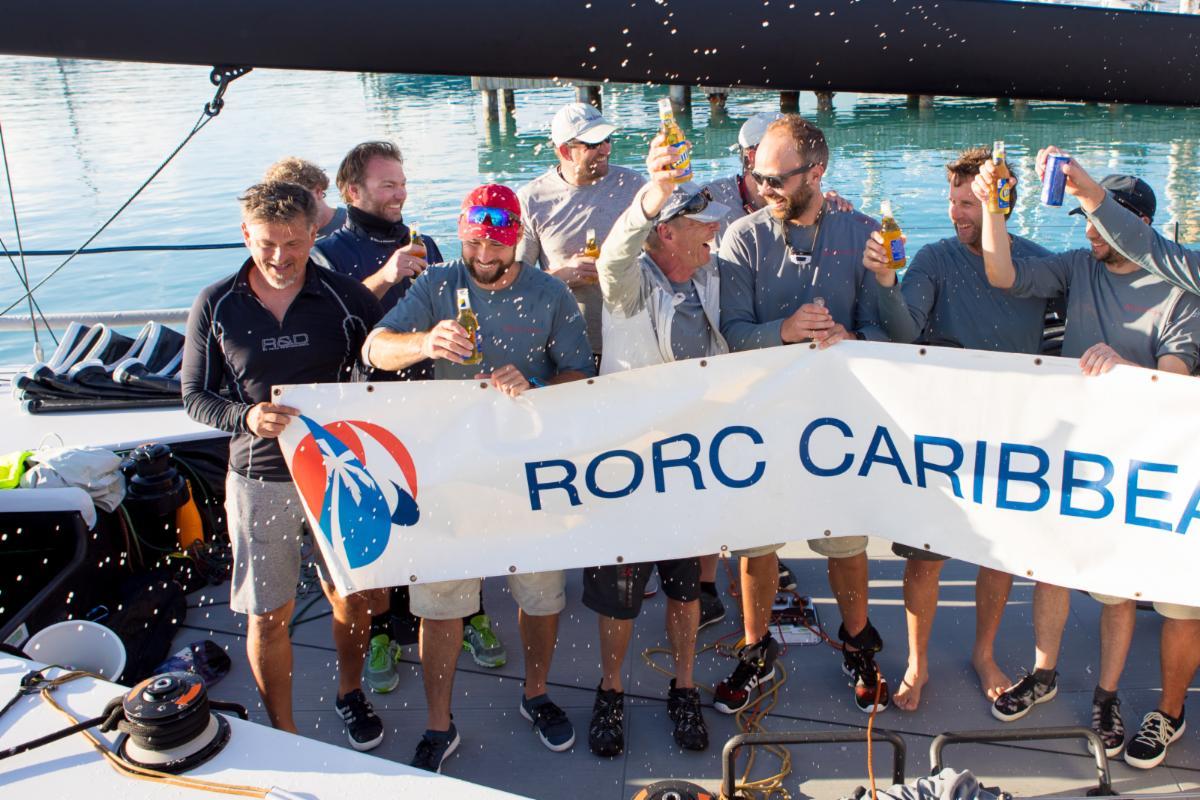 Tilmar Hansen from Kiel, Germany celebrates his birthday after completing the race with his team on TP52 Outsider © Arthur Daniel/RORC