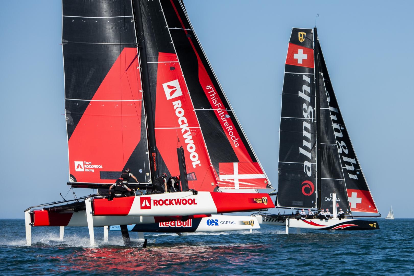 Alinghi leads Red Bull Sailing Team and Team Rockwool Racing down the reach.