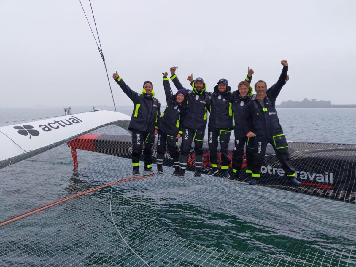 Yves le Blevec and the team on Ultime Actual celebrate after arriving at the finish line in an elapsed time of 1d 18h 41m 22s © Team Actual