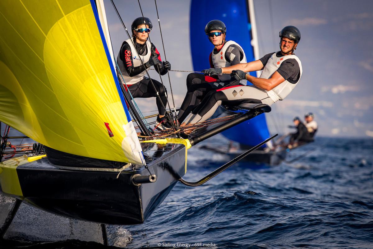 Tricky wind conditions and intense racing continues in Cagliari