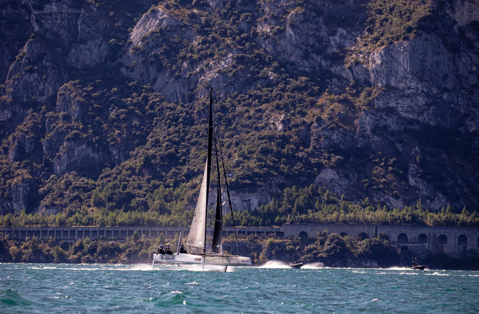 Racing next to Lake Garda's famous Quantum of Solace car chase road. Photo: Sailing Energy / GC32 Racing Tour