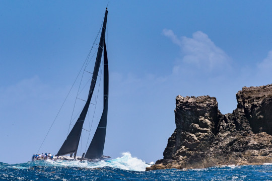 Rambler 88 and the island's rugged, Atlantic battered terrain. Photo: Christophe Jouany