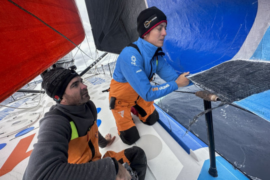 Leg 3, Day 8 onboard 11th Hour Racing Team. Justine Metttraux and Charlie Enright checking on the J2 repair and stanchion upgrade while on the bow.
Photo credit: Amory Ross