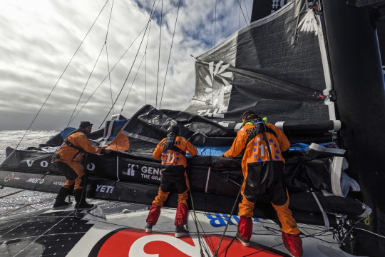 Leg 3 on board 11th Hour Racing Team. Charlie Enright, Justine Mettraux and Jack Bouttell work on replacing the broken batten and patching up the mainsail.
© Amory Ross