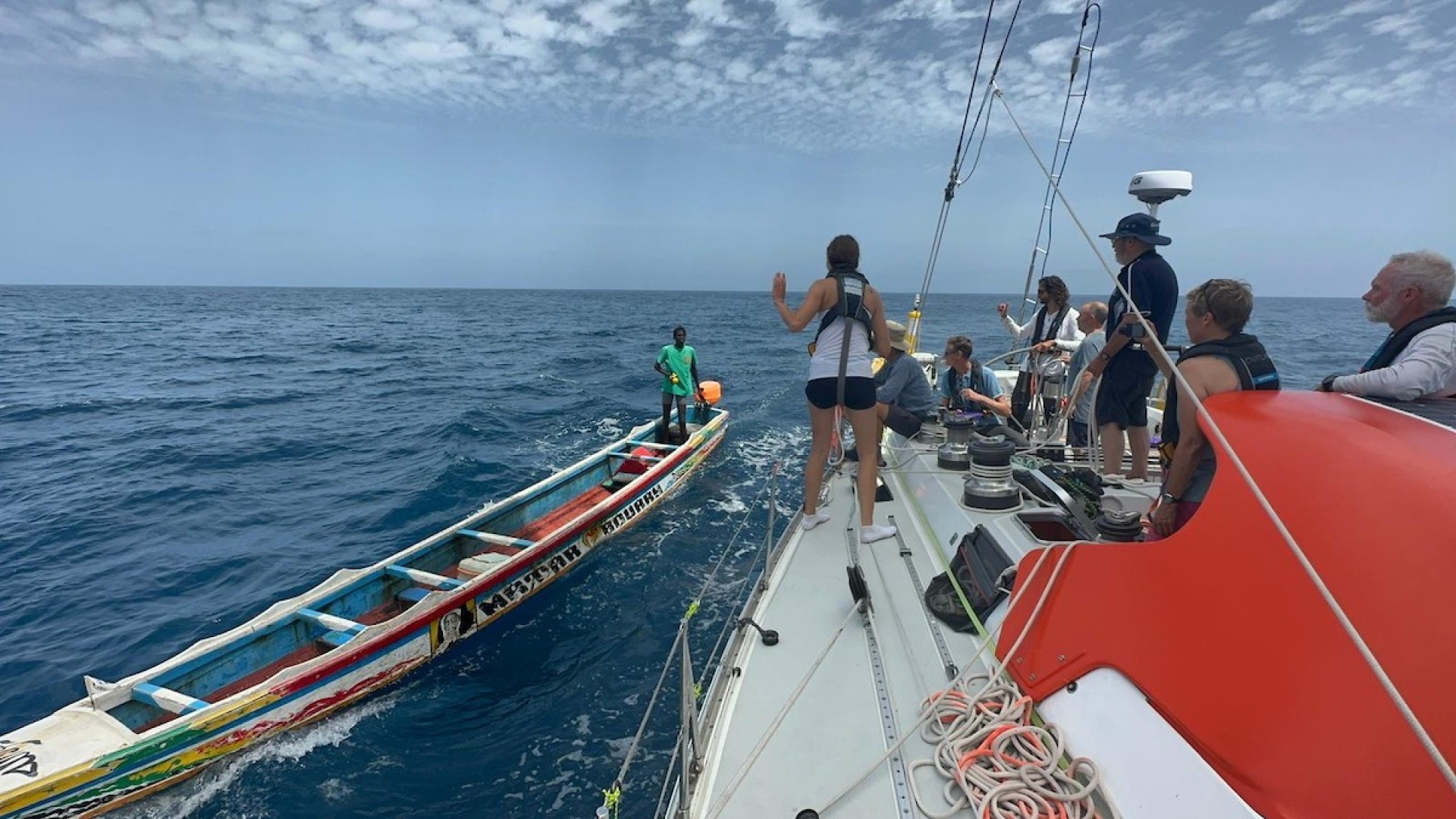 McIntyre OCEAN GLOBE 2023 - Drifting mariner coming alongside OGR entrant Outlaw whove suspended racing to divert to Dakar. Credit: Matt Sinnett-Jones Outlaw/Spirit of Adelaide/OGR2023