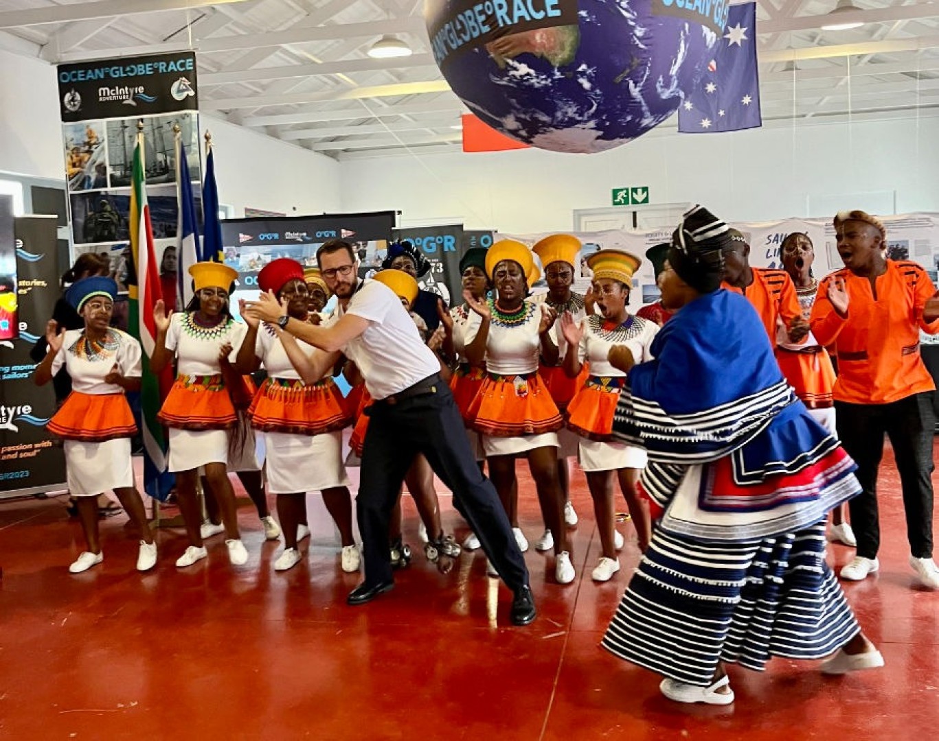 Francois Xavier Poisson, Commandant of French Friget Floréal, showing off his moves with the local dancers.
Credit: Jacqueline Kavanagh / OGR2023