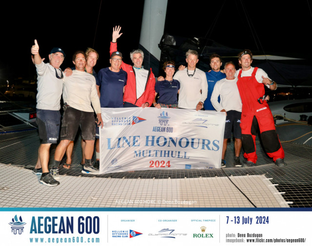 The line honours-winning Zoulou crew of Erik Maris (centre with arm raised), including French multihull legend Loick Peyron (far left) and Britain Ned Collier Wakefield (far right).