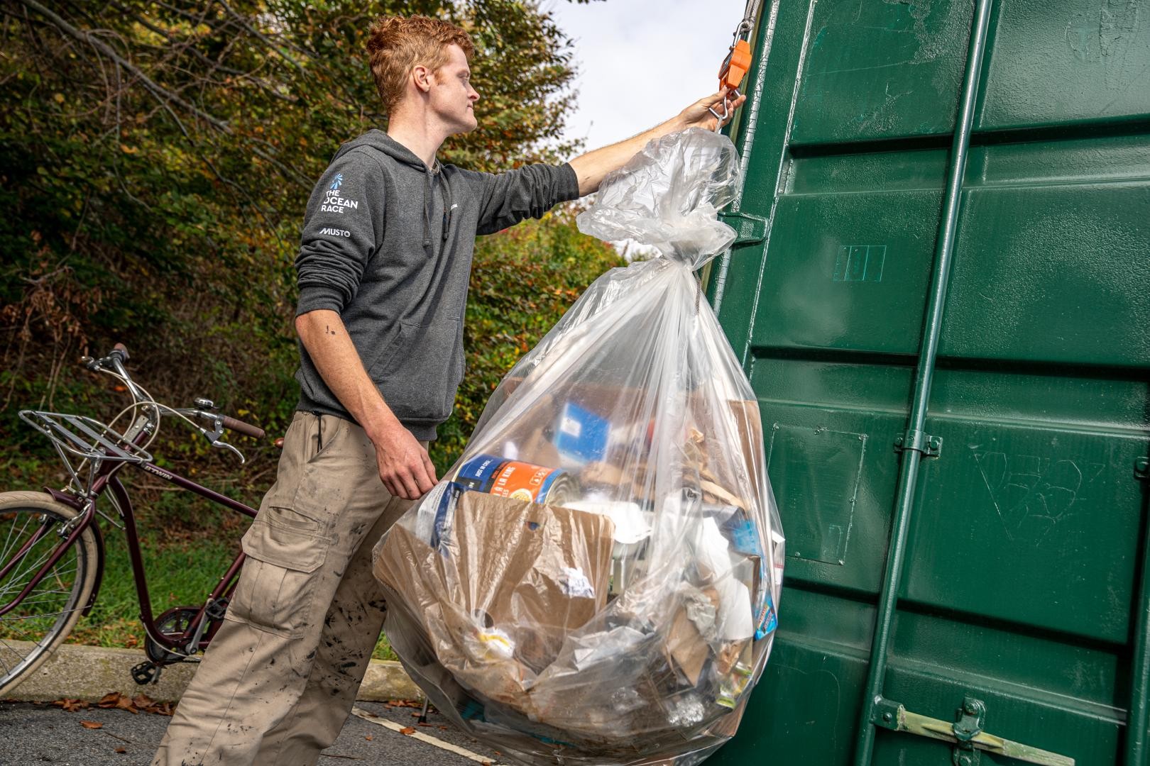 Cullen Zelenka a sustainability intern in Newport, Rhode Island weighs waste before recycling