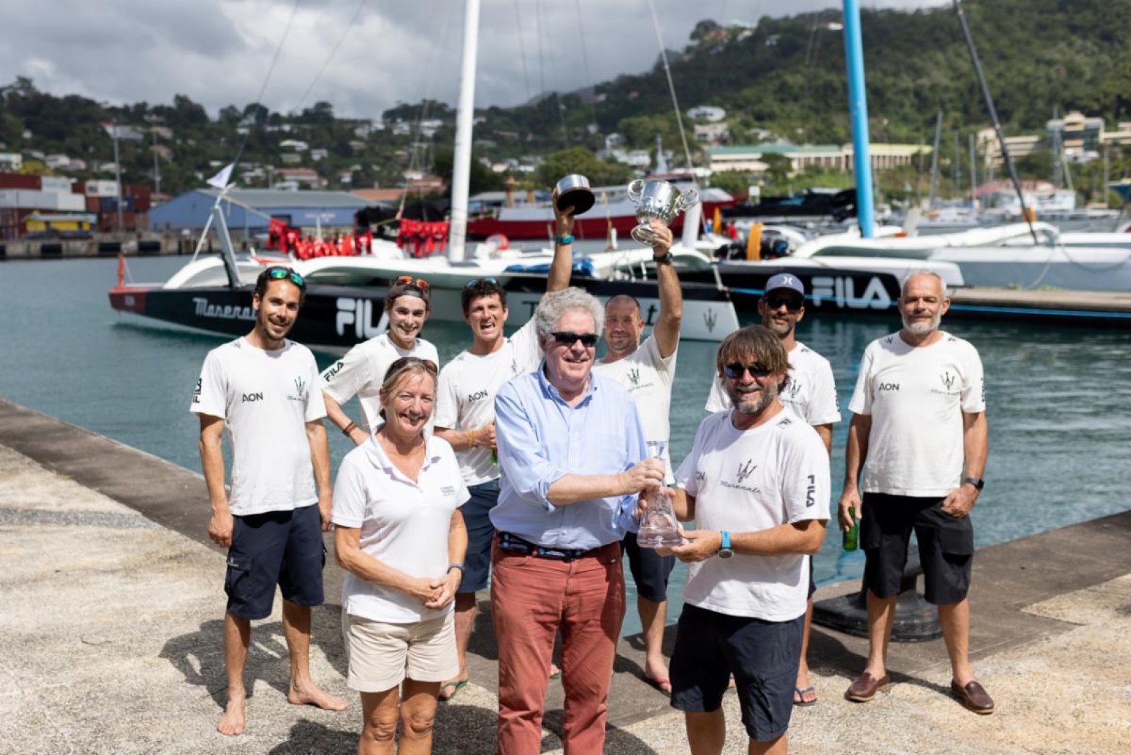 Andrew McIrvine presents Giovanni Soldini and team on Maserati Multi70 with the Multihull Line Honours trophy and keepsake in the RORC Transatlantic Race © Arthur Daniel/RORC