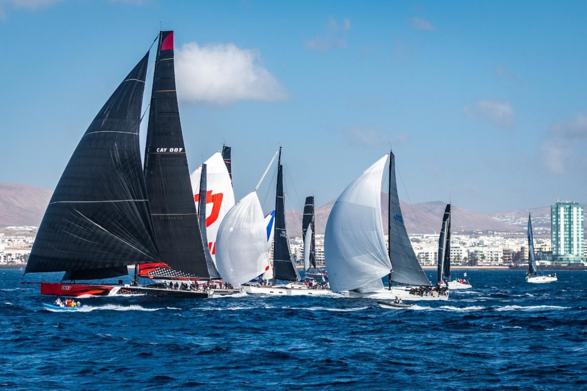 The mighty Comanche leads the fleet at the start of the RORC Transatlantic Race off Arrecife's Marina Lanzarote, Canary Islands