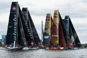 The international fleet of GC32s in action in tight racing meters from fans on the shore line