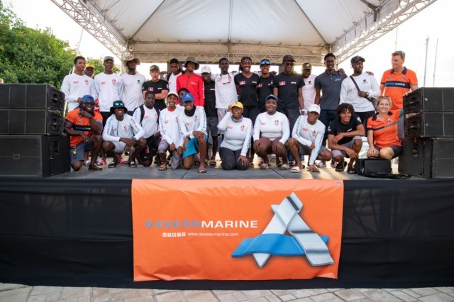 Opportunity knocks for young sailors racing at Antigua Sailing Week on Axxess Marine Y2K Race Day. Founder of Axxess Marine, Dennis Henri, together with Andrea Carmichael, COO of Axxess Marine was on the stage for today's Prize Giving © Ted Martin