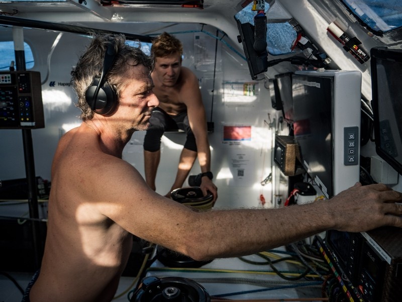 5 February 2023, Leg 2, Day 12 onboard Team Malizia. Yann Elies and Will Harris on the computer checking the foil loads as they are now sailing on a range of 25-33 knots. © Antoine Auriol / Team Malizia