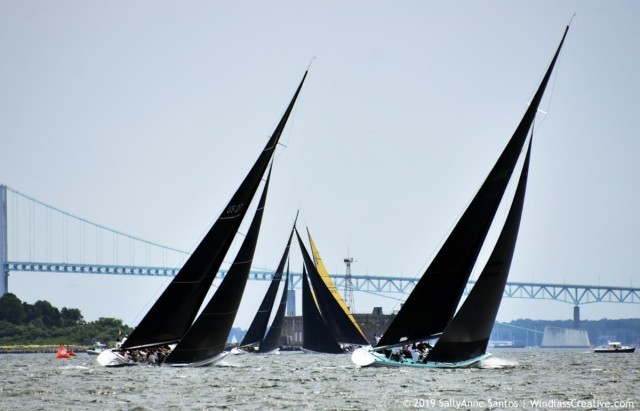 Enterprise (US-27) and Courageous (US-26) chasing the Grand Prix fleet to weather at the 2019 12mR World Championship in Newport, Rhode Island.