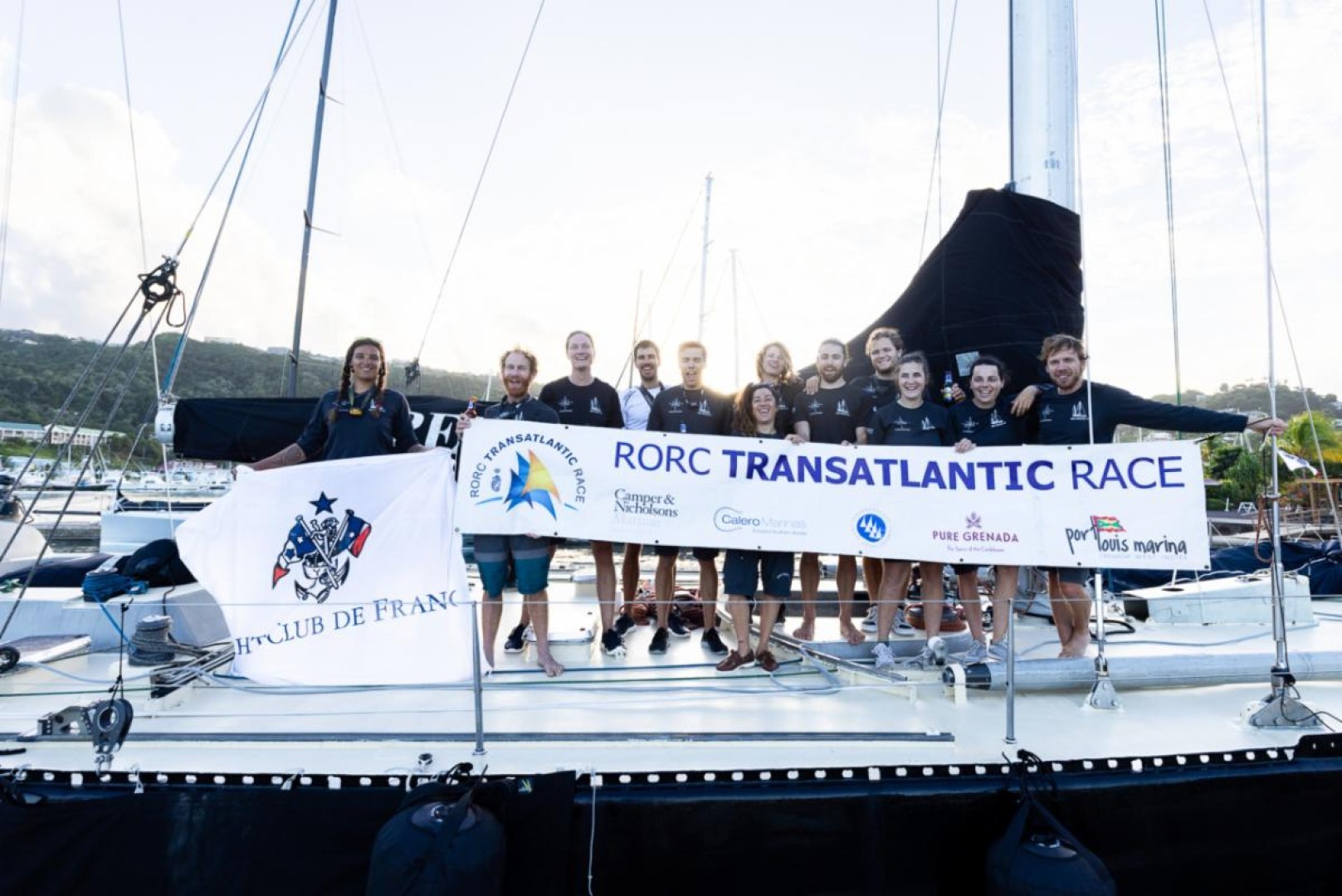 Celebrating after the finish in Grenada. Proudly displaying the flag of the Yacht Club de France