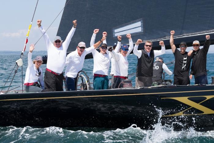 Challenge XII (KA-10) owner/helmsman Jack LeFort (second from left) celebrates victory and a World Championship title after today’s final race of the 2019 12 Metre World Championship