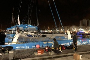 Fast and efficient pit-stop by Vauchel-Camus's shore team to repair the mainsail track on his mast and replace the mainsail headboard car