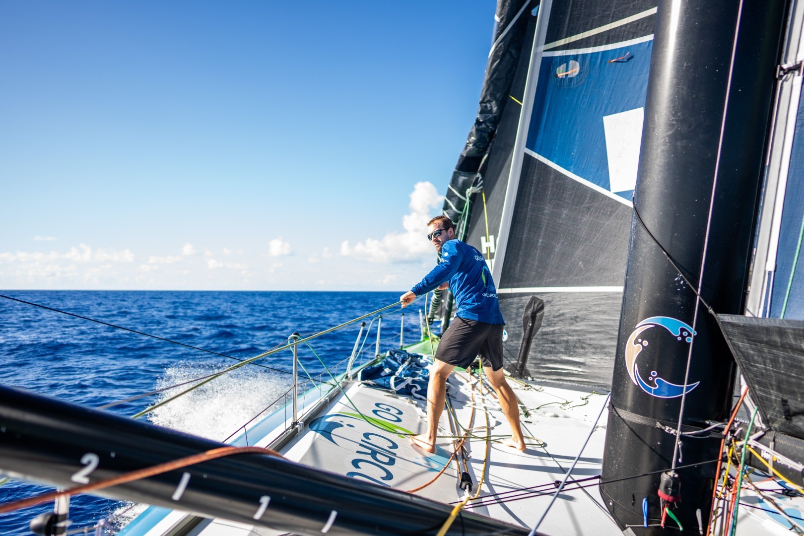 Leg 2, Day 9 onboard Team Holcim - PRB. Sam Goodchild assists with the hoist. © Georgia Schofield / The Ocean Race
