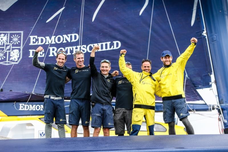 The crew of Ultim Maxi Edmond de Rothschild celebrate their record-breaking run today. Skippers (right) Franck Cammas / Charles Caudrelier with David Boileau, Erwan Israël, Morgan Lagraviere, Yann Riou