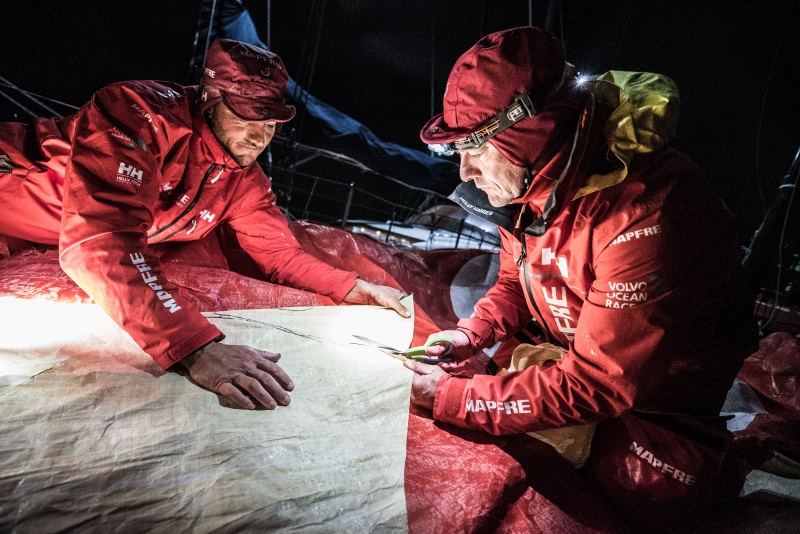 Volvo Ocean Race Leg 7 from Auckland to Itajai, on board MAPFRE, Santi and Blair cutting a piece of 3Di for the mainsail