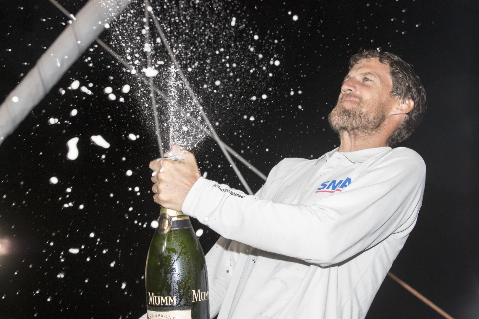 Paul Meilhat (SMA) enjoying his champagne moment after winning the IMOCA class in the Route du Rhum-Destination Guadeloupe.