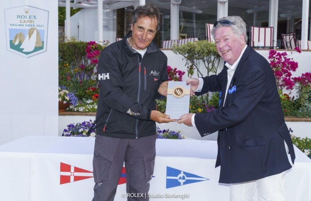Fra Diavolo owner Vincenzo Addessi receives the prize for winning the Maxi Yacht Capri Trophy from International Maxi Association Secretary General Andrew McIrvine.
