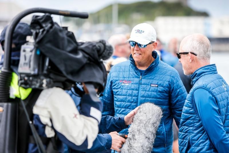 David and Peter Askew hit the dock for some interviews after winning yet another offshore classic yacht race with their VO70 Wizard
